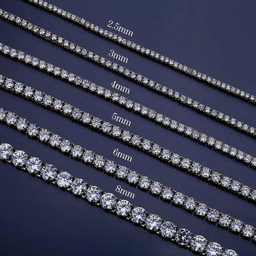 Yellow gold plated tennis necklace with snap lock.