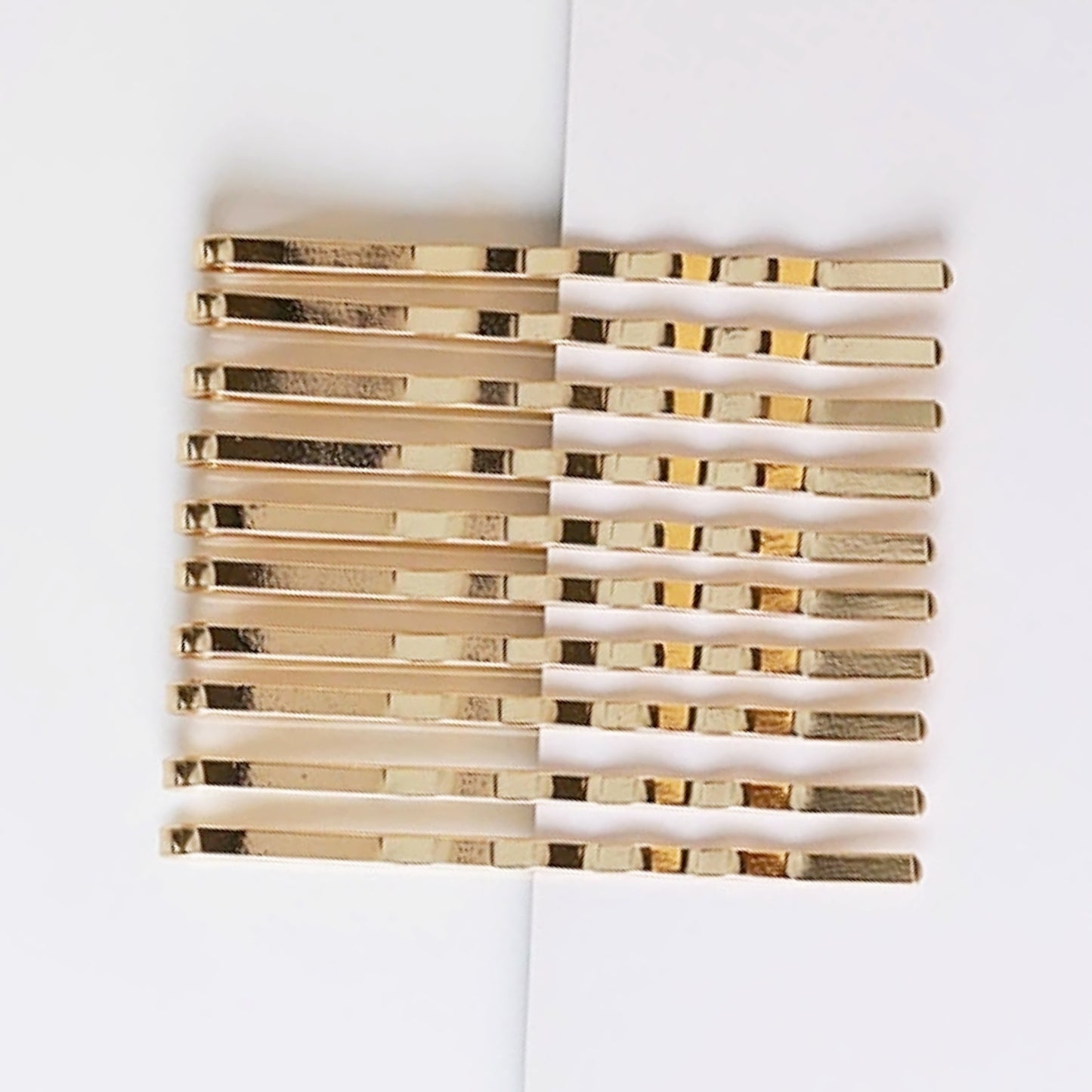 10 piece yellow gold bobby pin set.