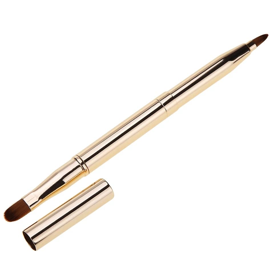 Double ended, retractable, metallic, yellow gold lipstick brush with matching gold cap.