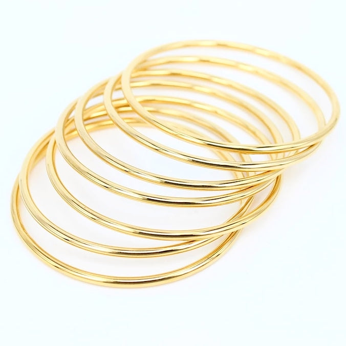 7 piece yellow gold plated bangle set.