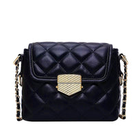 Black, pu leather, quilted messenger handbag with gold buckle and gold chain covered black strap. Square shape.